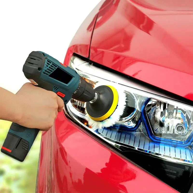 Polishing car headlight with drill buffer attachment for auto detailing.