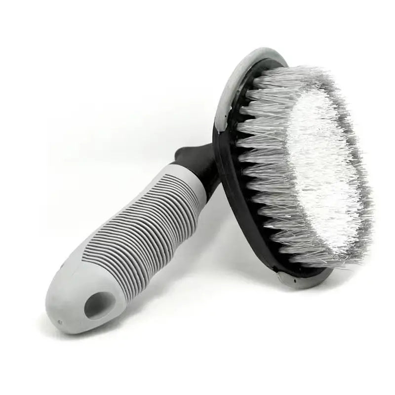 Detailing brush with gray handle and soft white bristles.