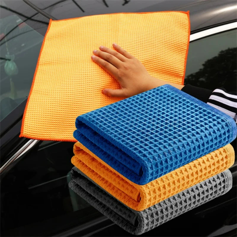 Car cleaning microfiber towels: orange, blue, yellow and gray waffle weave design.