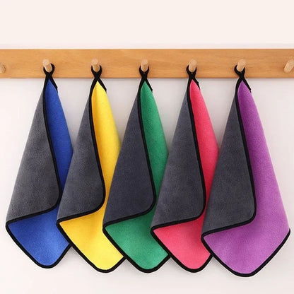 Colorful microfiber towels hanging on a wooden rack. Includes blue, yellow, green, pink, and purple options.